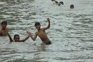 Indian boys in river