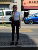 Skinny girl with stunning body waiting at bus stop