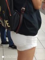Candid girk with beautiful skinny ass in white shorts
