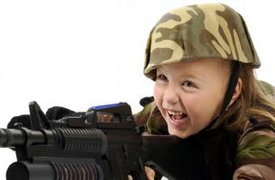little girls playing with daddies big gun