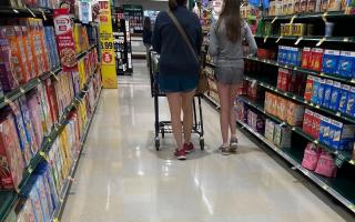 Candid legs in grocery store