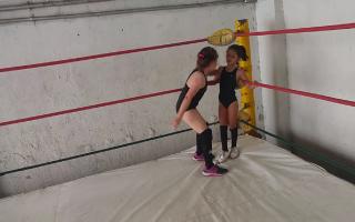 Latin little girls fight (7 vs 9 yo) wrestling in ring