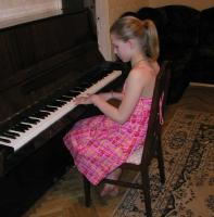 cute girl playing piano