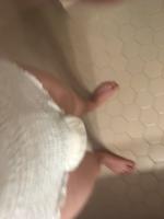 Bedwetting boy in used diaper